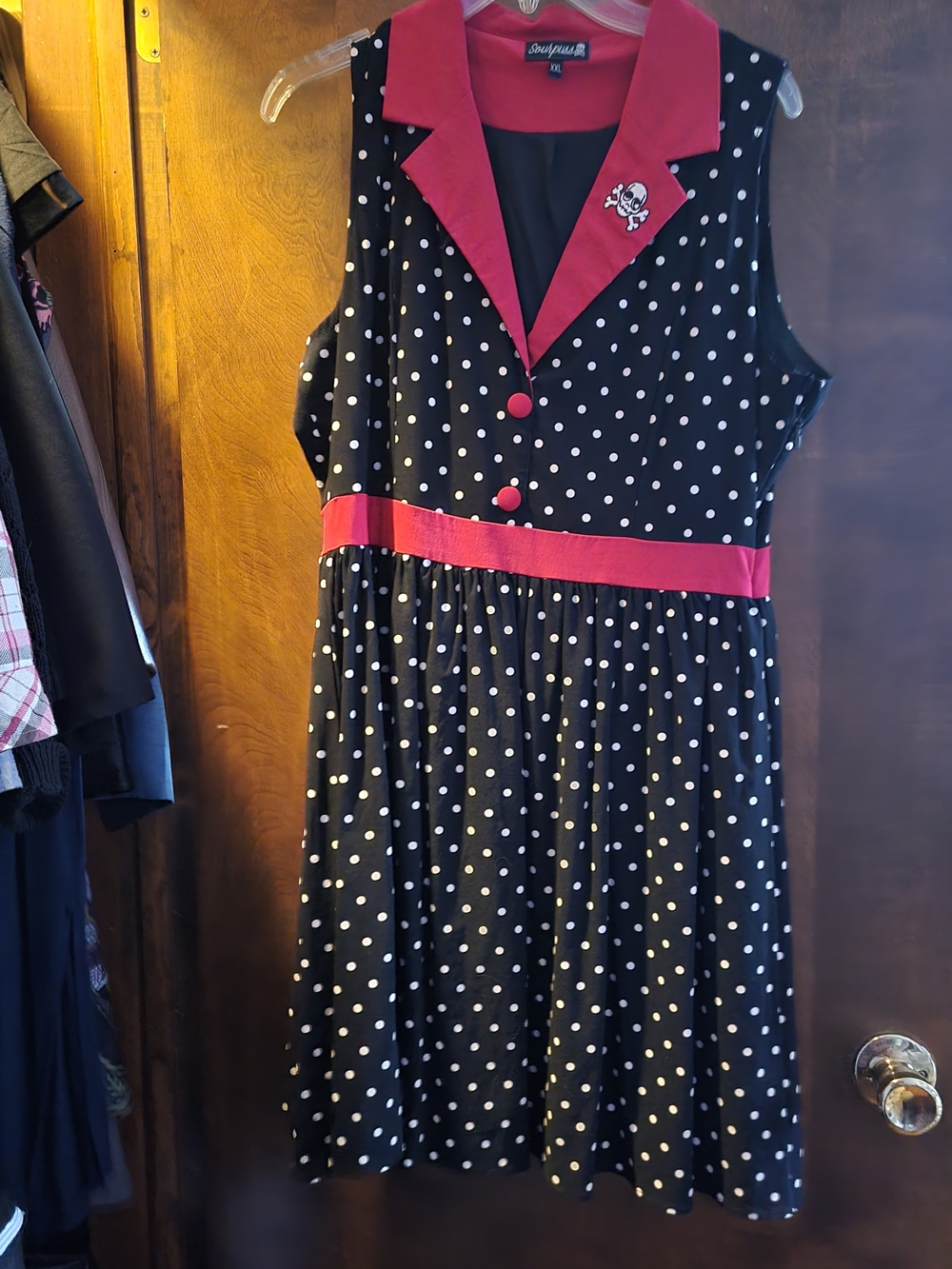 Polka Dot Sleeveless Dress with Red Accents